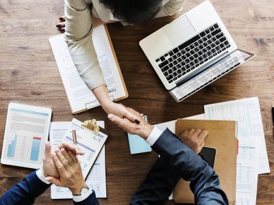 Business people shaking hands together